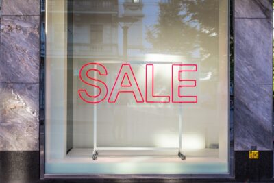 'SALE' sign in shop window.