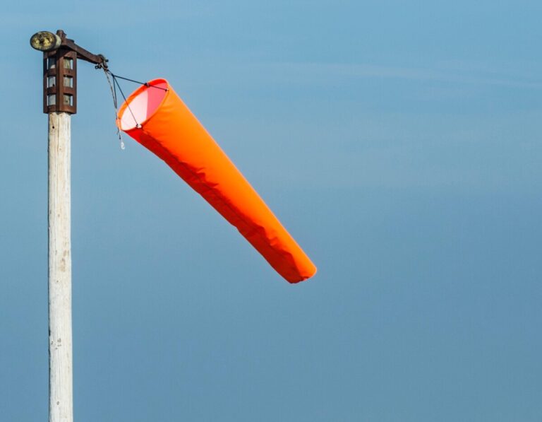 Orange windsock with little wind.