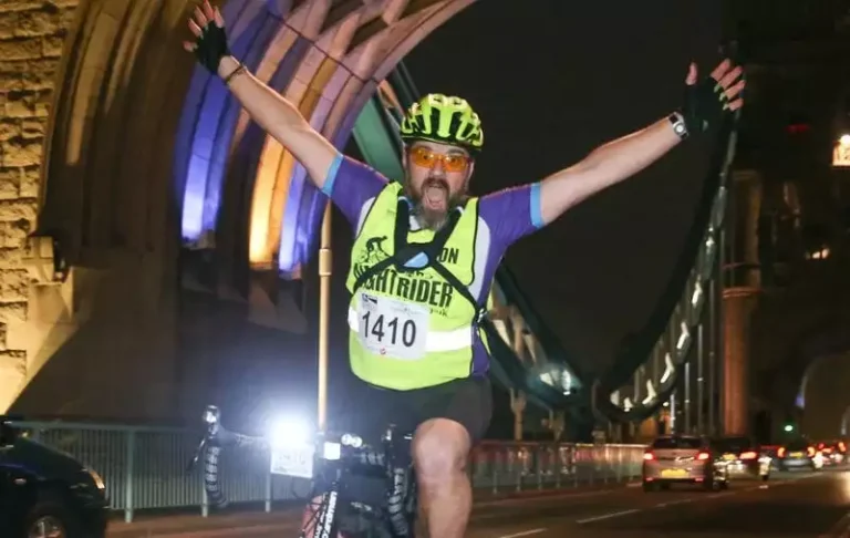 Nightrider London passing under Tower Bridge