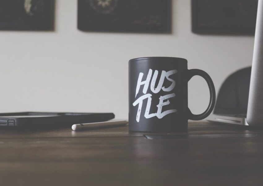 Mug with 'hustle' on the side - photo: Unsplash