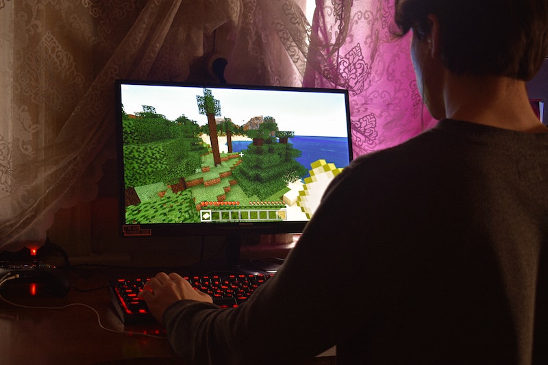 Person plays Minecraft on computer.