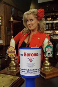 Beverley Callard pulling a pint