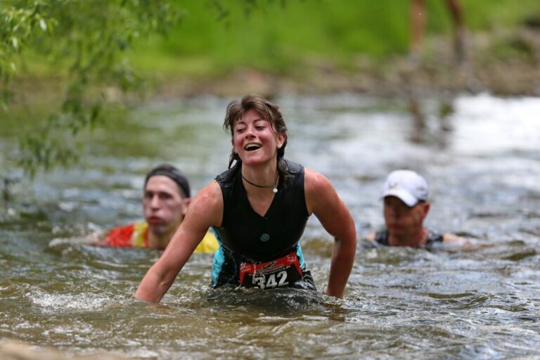 three people in water taking part in a steeplechase. Photo: Pixabay