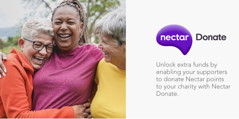 Three women hugging and laughing, advertising Nectar Donate