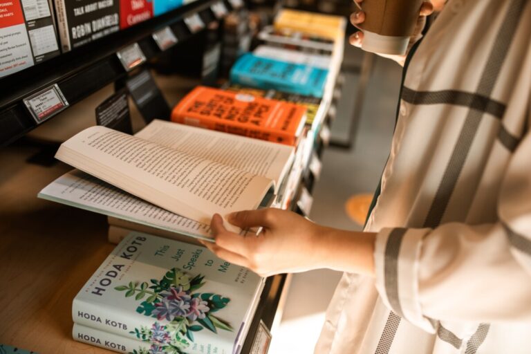 Leafing through a book in a bookshop