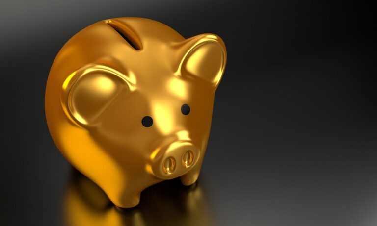 a gold piggy bank on a black background