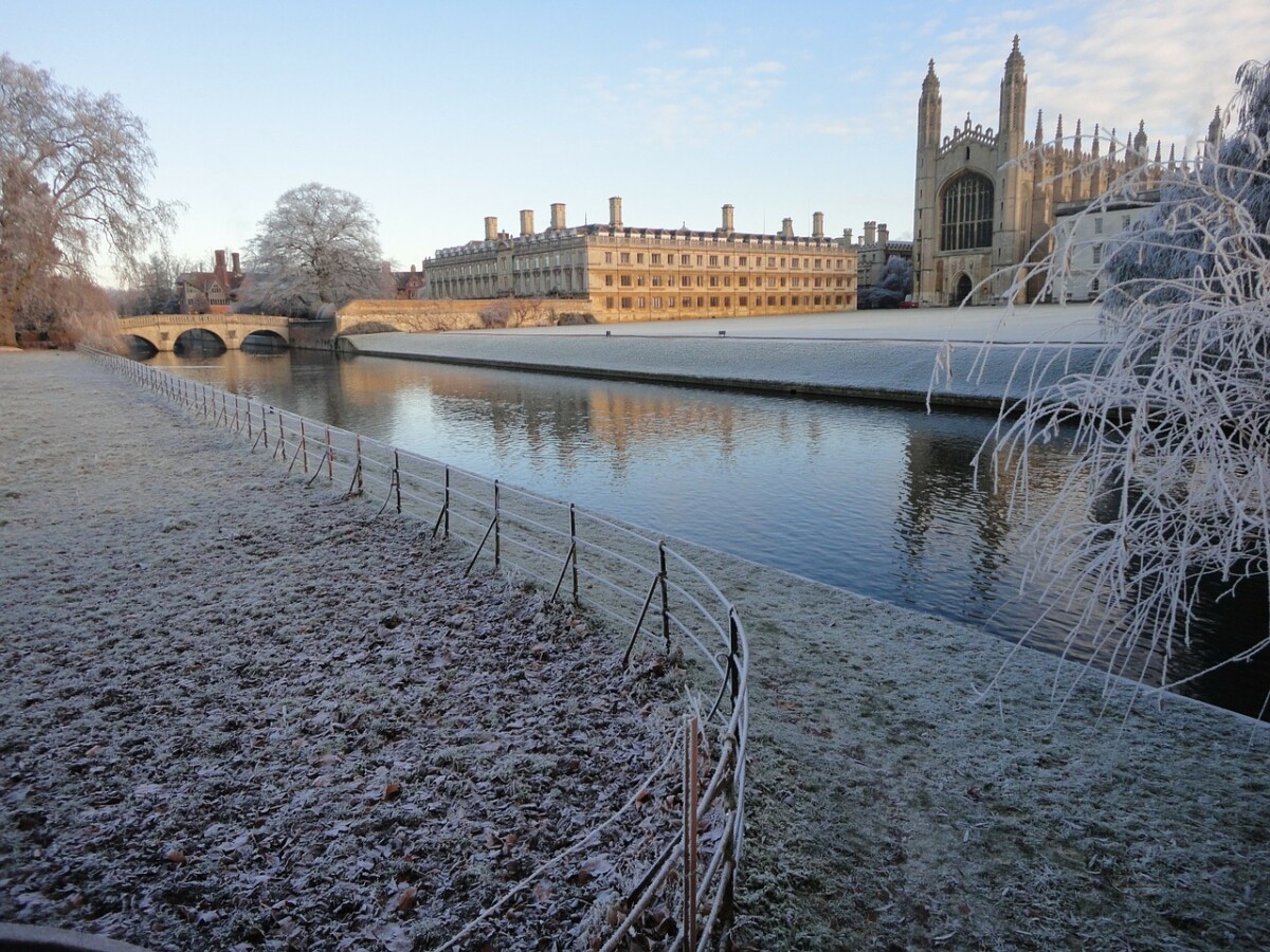 Frost lies on the grass by the river Cam, in front of Kings College