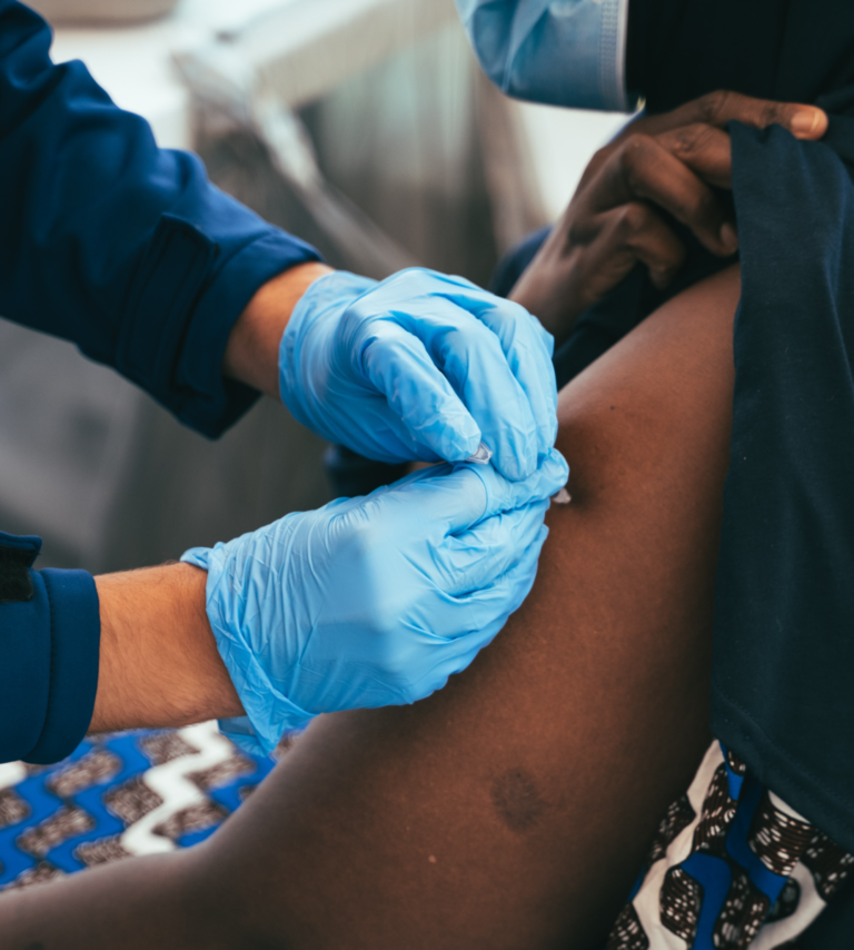 A woman receives a COVID-19 vaccination.