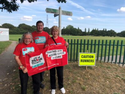 Participants in fundraising event The Fun Walk, dressed in red Brain Tumour charity t-shirts