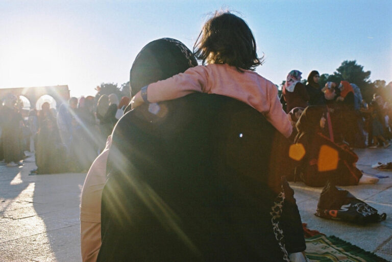 Family during Ramadan, in the open air, amid blue sky - photo: Mouna Kalla-Sacranie