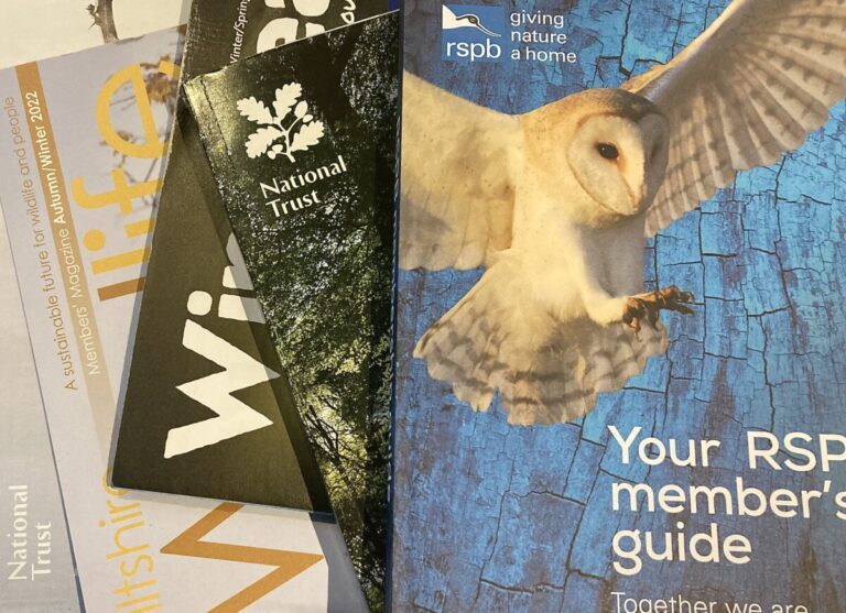 A stack of charity membership magazines and handbooks. Image by Melanie May