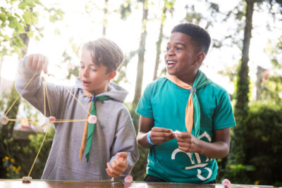 Two cubs making marshmallow models