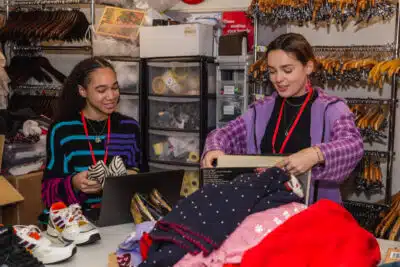 Young BHF volunteers sorting items in Manchester