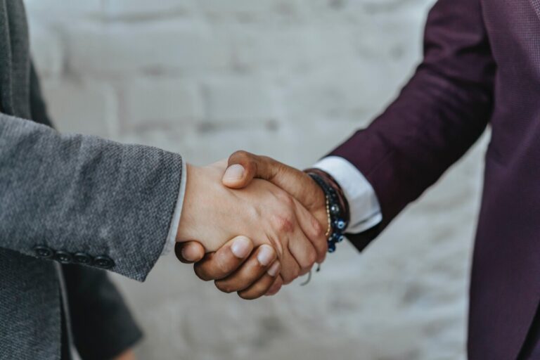 Two men shaking hands. By Olia Danilevich on Pexels