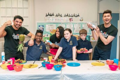 Three Scottish celebrities - Anton Danyluk, Jean Johansson and Sean Batty compete in pancake challenge with their schoolchildren partners