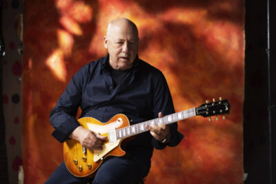 Mark Knopfler with a guitar. Copyright: Murdo McLeod