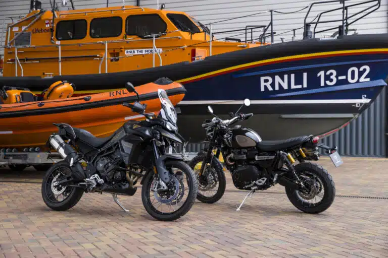 Daniel Craig's Triumph motorbikes in front of an RNLI lifeboat. Credit: RNLI/ Triumph