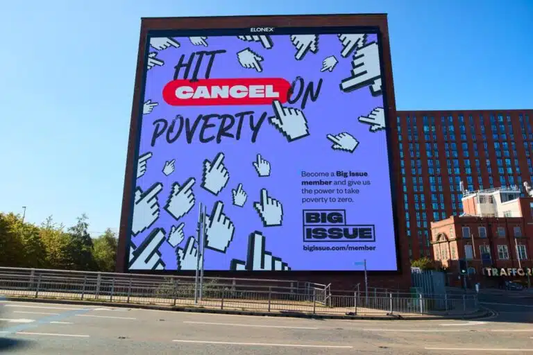 An outdoor ad for Big Issue's membership scheme, saying 'hit the button on poverty'