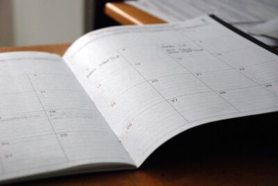 An open diary, showing some calendar dates. By Eric Rothermel on Unsplash