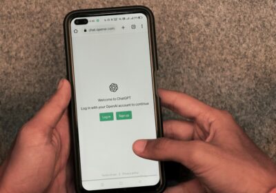 The login screen on ChatGPT on a phone, held in a man's hands. By Sanket Graphy on Pexels