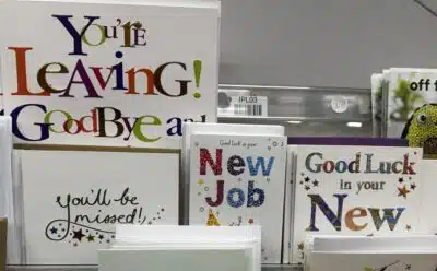 New job congratulations cards on a shop rack.