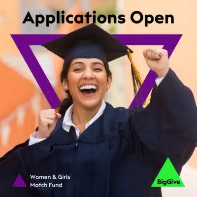 Applications open. Big Give Women and Girls Match Fund. Big Give logo in bottom right corner. A smiling woman in a mortar board with fist raised in delight signifies the value of education.